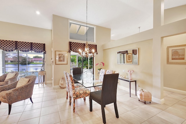 dining area with a notable chandelier and light tile patterned floors