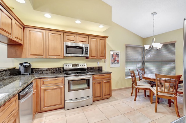 kitchen with appliances with stainless steel finishes, light tile patterned flooring, hanging light fixtures, vaulted ceiling, and an inviting chandelier