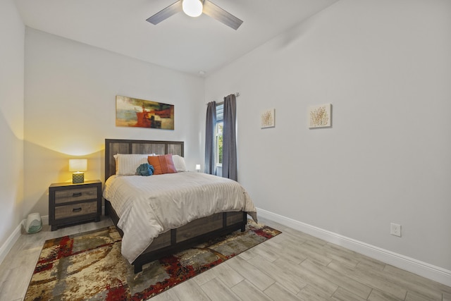 bedroom with light hardwood / wood-style flooring and ceiling fan