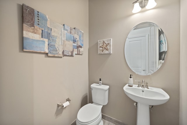 bathroom with wood-type flooring and toilet