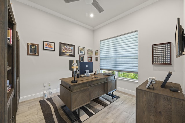 office space with light hardwood / wood-style floors, ornamental molding, and ceiling fan