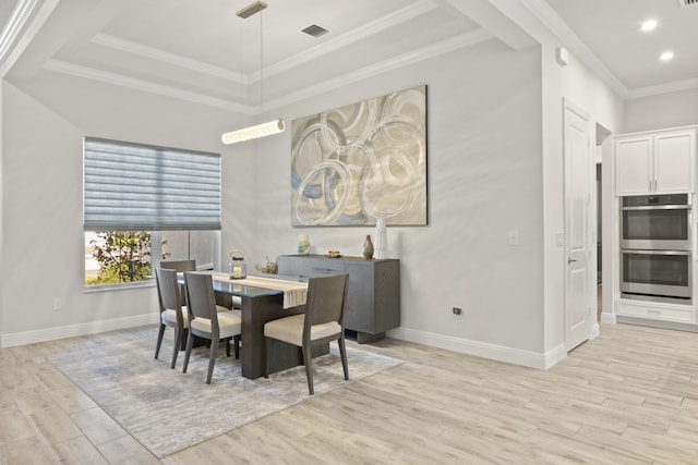 dining room featuring light wood-type flooring and ornamental molding