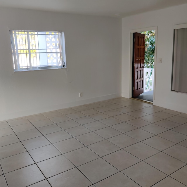 empty room with light tile patterned floors