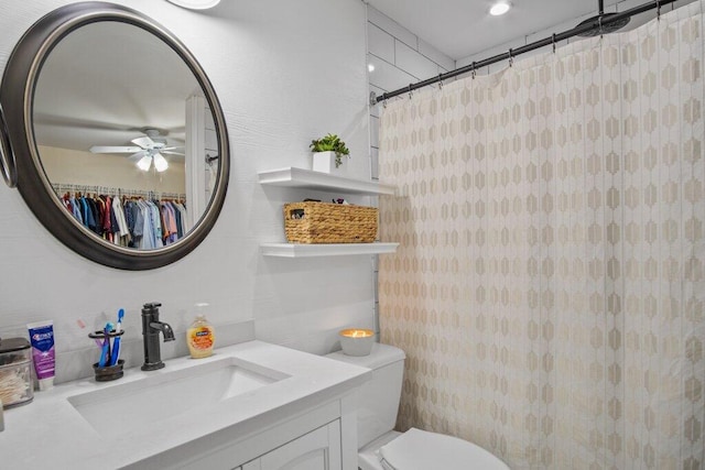 bathroom featuring ceiling fan, vanity, toilet, and a shower with shower curtain