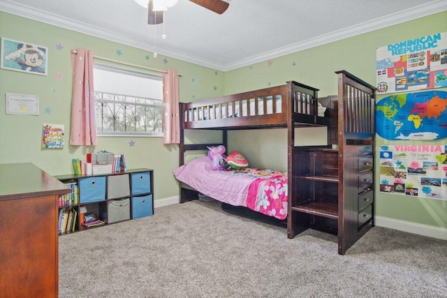 bedroom with ornamental molding, ceiling fan, and carpet