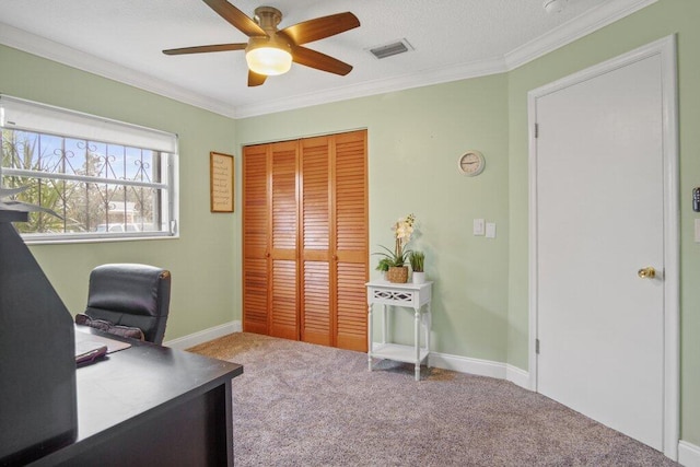 office featuring carpet floors, a textured ceiling, ornamental molding, and ceiling fan