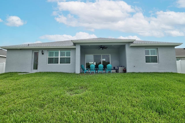 back of house featuring a yard, a patio area, and ceiling fan