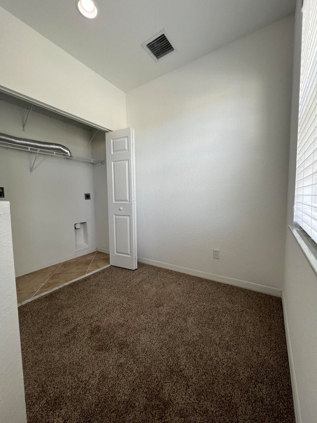 clothes washing area with hookup for an electric dryer and carpet floors