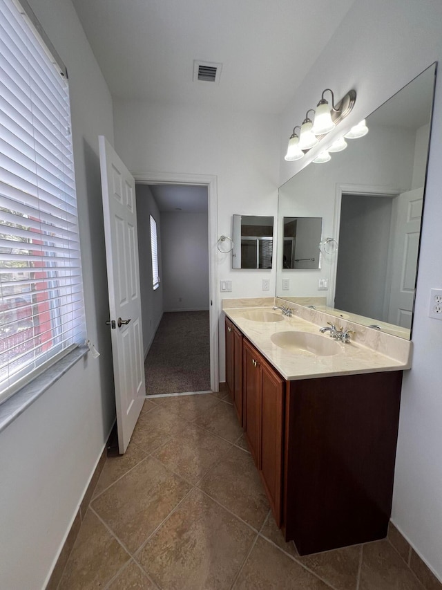 bathroom with vanity and tile patterned floors