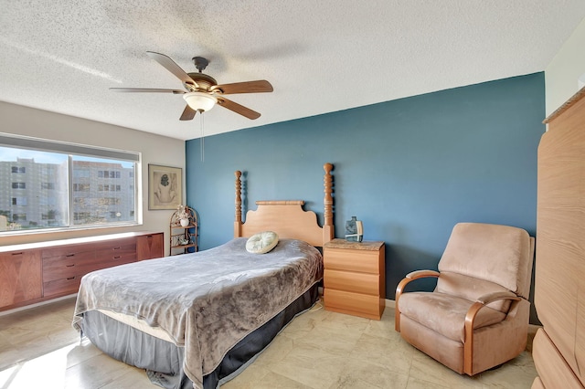 bedroom featuring ceiling fan, a baseboard radiator, and a textured ceiling