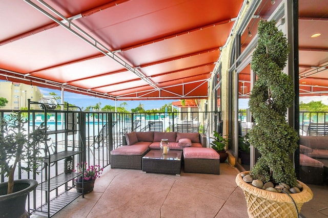 view of patio with a water view and an outdoor hangout area