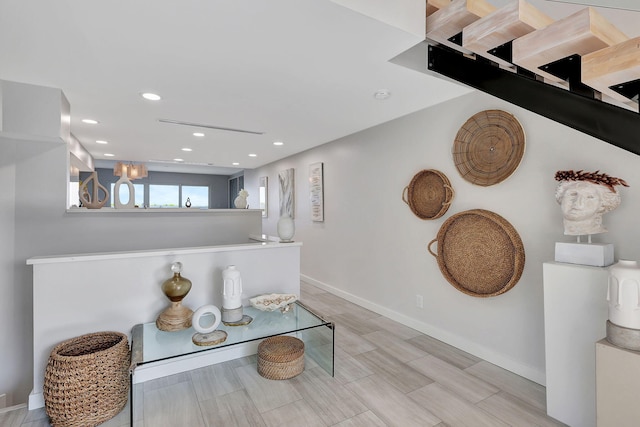 kitchen with pendant lighting, sink, kitchen peninsula, white appliances, and white cabinetry