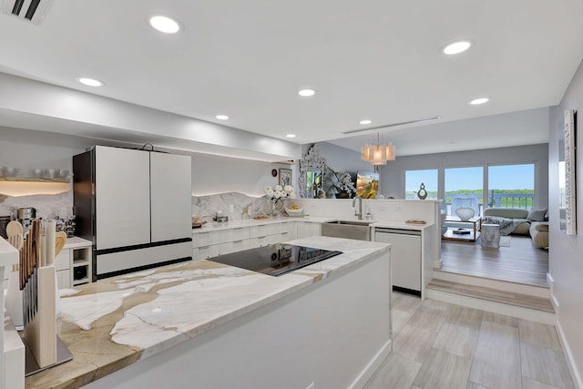 kitchen with backsplash and white fridge