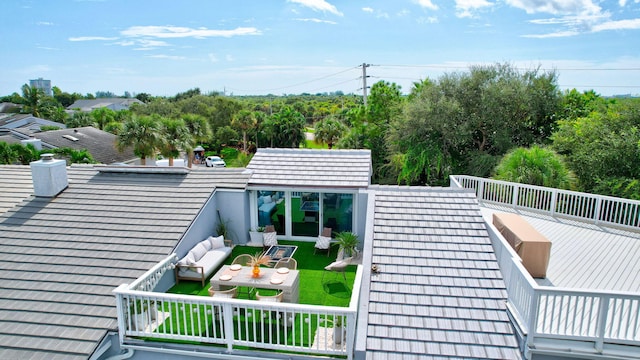 rear view of property featuring a balcony