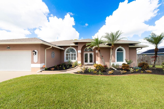 ranch-style house featuring a garage and a front yard