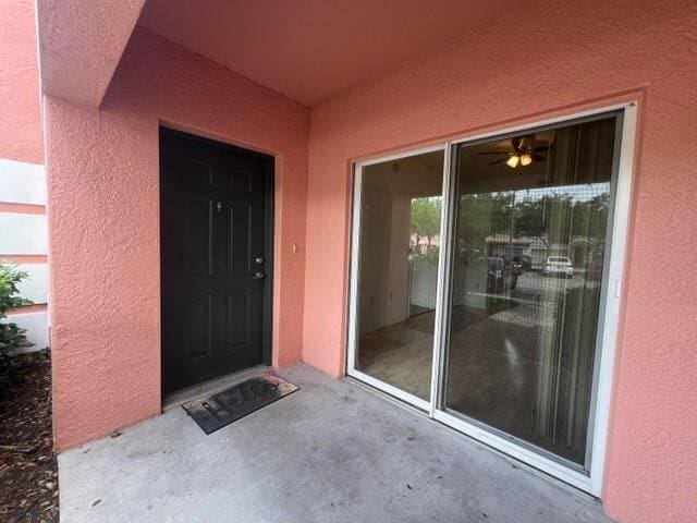 property entrance with a patio