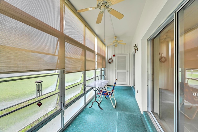 unfurnished sunroom with ceiling fan and a healthy amount of sunlight