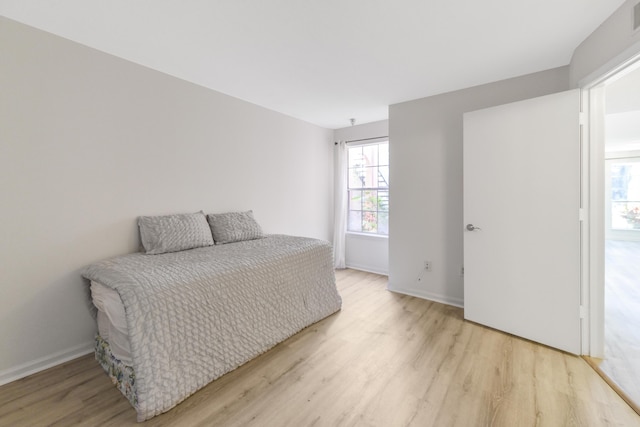 bedroom with light wood-type flooring