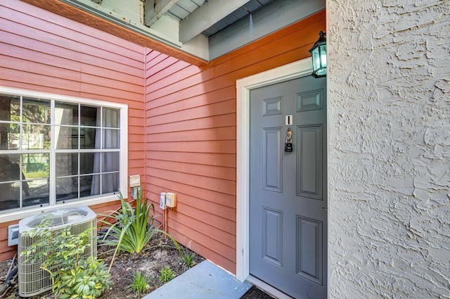 entrance to property featuring central AC unit