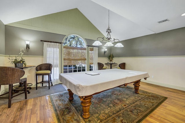 playroom featuring wood-type flooring, high vaulted ceiling, and billiards