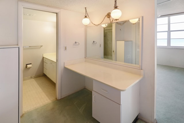 bathroom with vanity and a textured ceiling