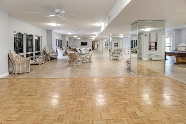 interior space featuring ceiling fan and light tile patterned floors