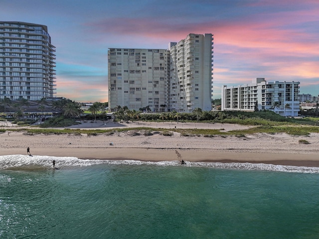 exterior space featuring a water view and a view of the beach