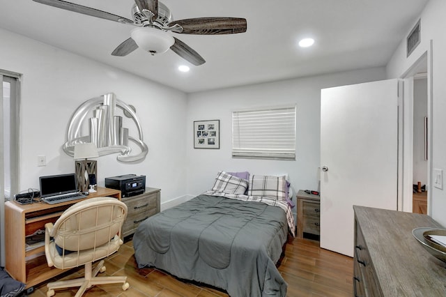 bedroom featuring ceiling fan and dark hardwood / wood-style flooring