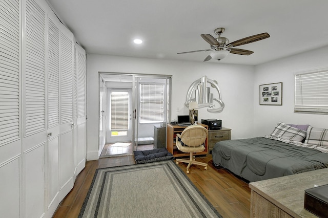 bedroom featuring ceiling fan and dark wood-type flooring