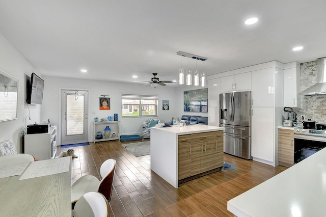 kitchen featuring pendant lighting, a center island, dark wood-type flooring, stainless steel fridge with ice dispenser, and range with electric cooktop