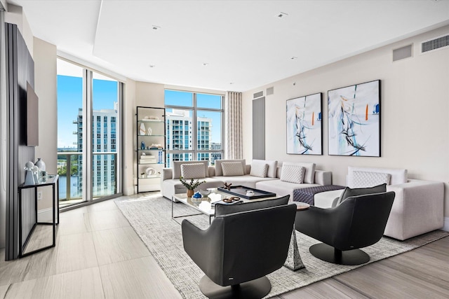 living room featuring a wall of windows