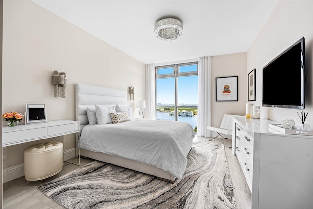 bedroom with light hardwood / wood-style floors