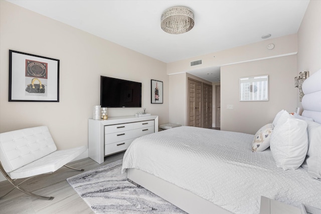 bedroom featuring light hardwood / wood-style floors