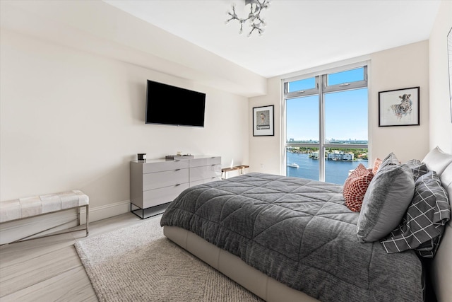 bedroom with hardwood / wood-style flooring