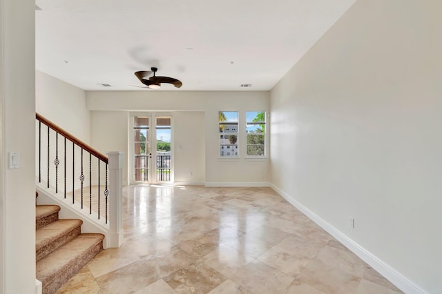 unfurnished room featuring ceiling fan