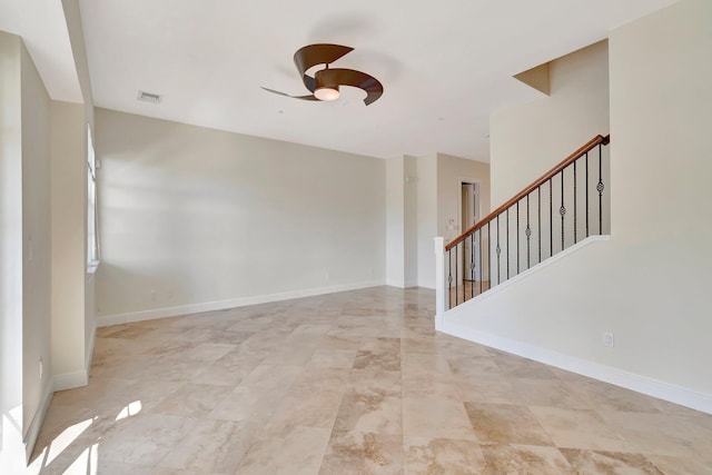 unfurnished room with ceiling fan