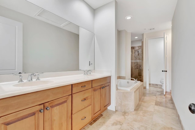 full bathroom featuring independent shower and bath, vanity, and toilet