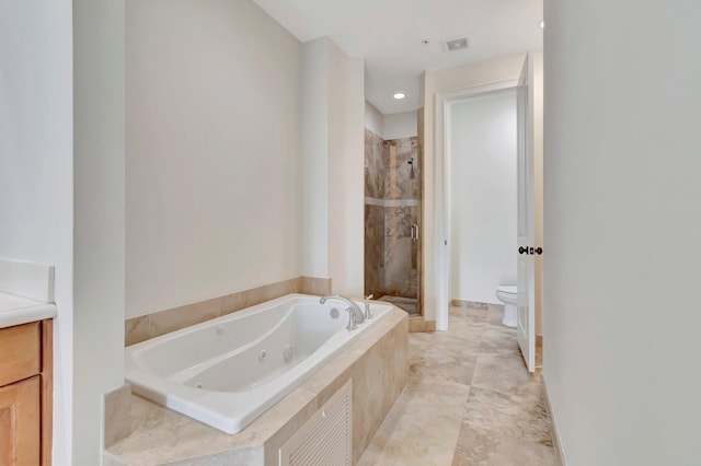 full bathroom featuring separate shower and tub, vanity, and toilet