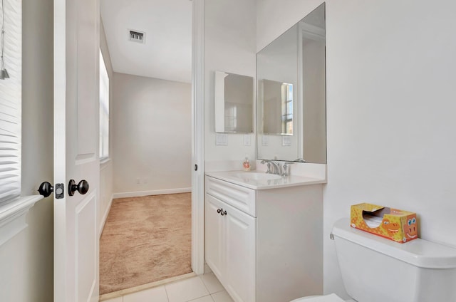 bathroom featuring vanity, toilet, and tile patterned floors