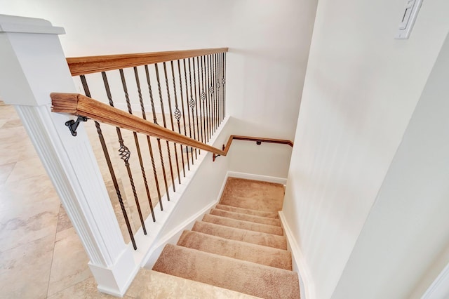 stairs featuring tile patterned floors