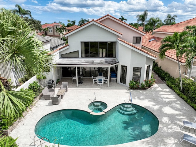 rear view of property featuring a patio