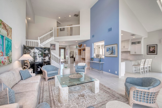 living room featuring high vaulted ceiling