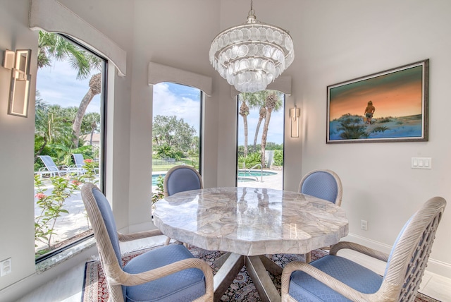 dining area with a notable chandelier