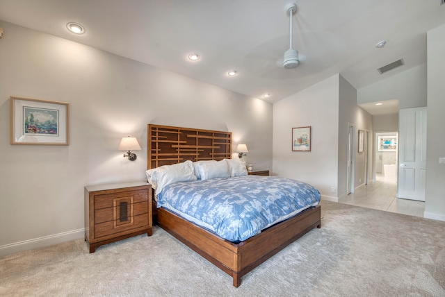 carpeted bedroom featuring lofted ceiling and ceiling fan