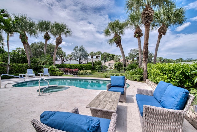 view of swimming pool with an outdoor hangout area, an in ground hot tub, and a patio