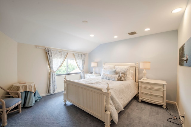 bedroom with carpet floors and lofted ceiling