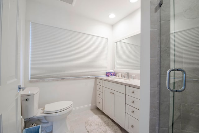 bathroom featuring tile patterned flooring, walk in shower, vanity, and toilet