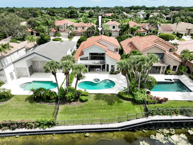 view of pool featuring a patio area and a yard