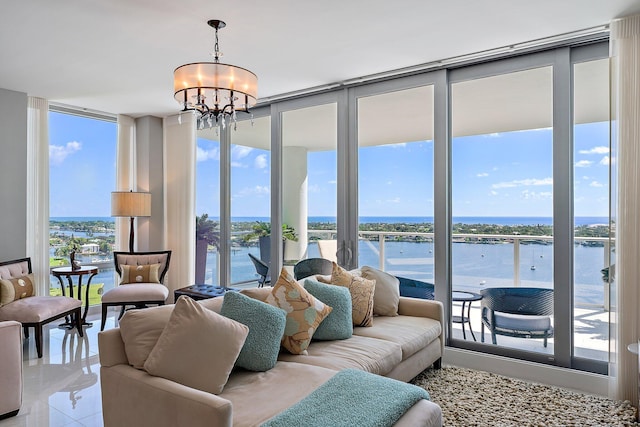 tiled living room with a wall of windows, a water view, and a chandelier