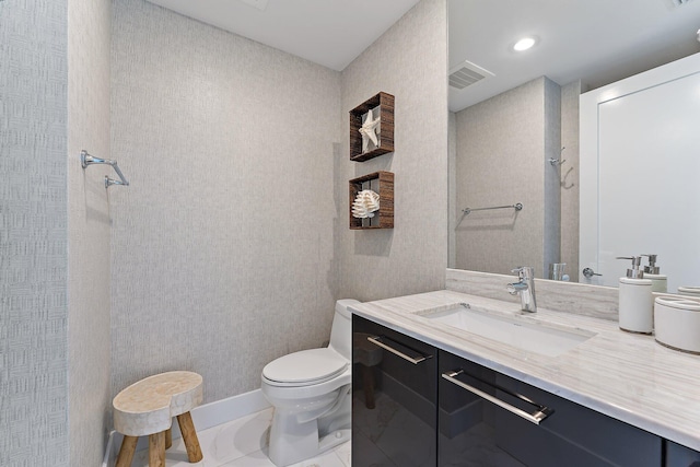 bathroom with a shower, vanity, toilet, and tile patterned floors